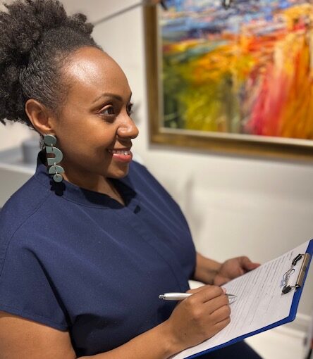 Catara Med Spa provider reviewing a client intake before laser vein removal in Algonquin, IL