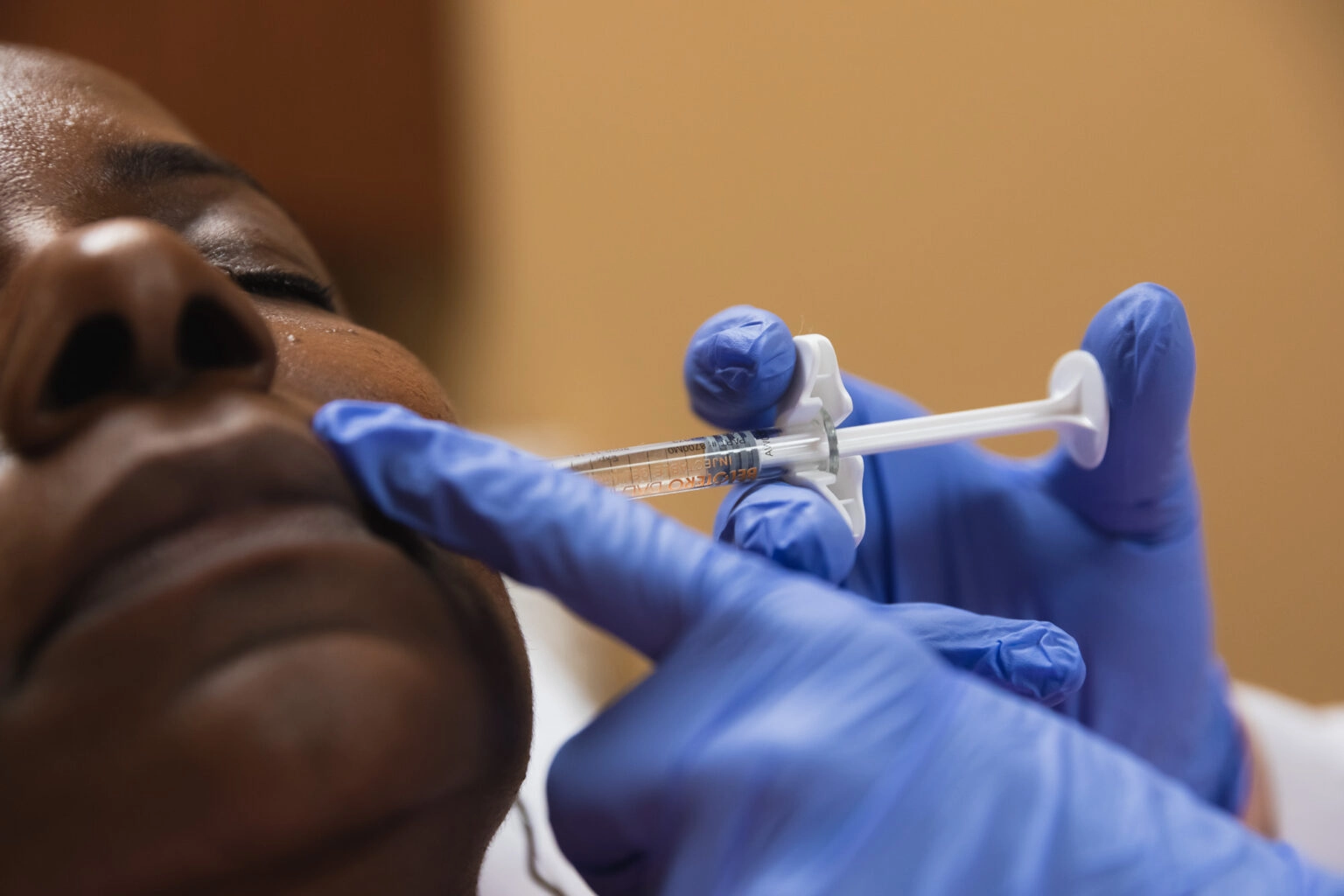 Provider performing a dermal filler injection during an injectable treatment at Catara Med Spa in Algonquin, IL.