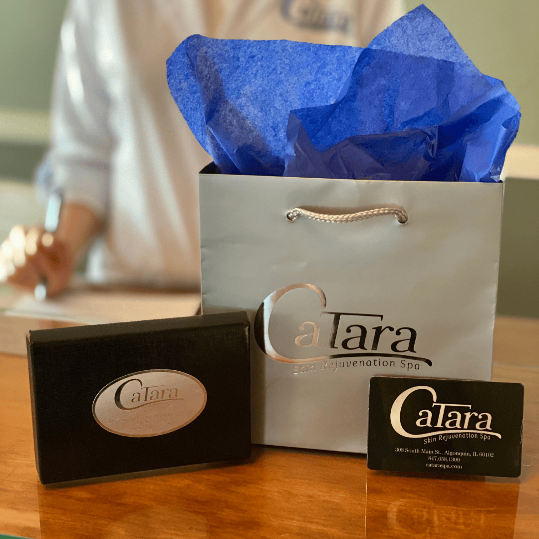 Catara Med Spa gift bag and gift card on display at the front desk in Algonquin, IL.