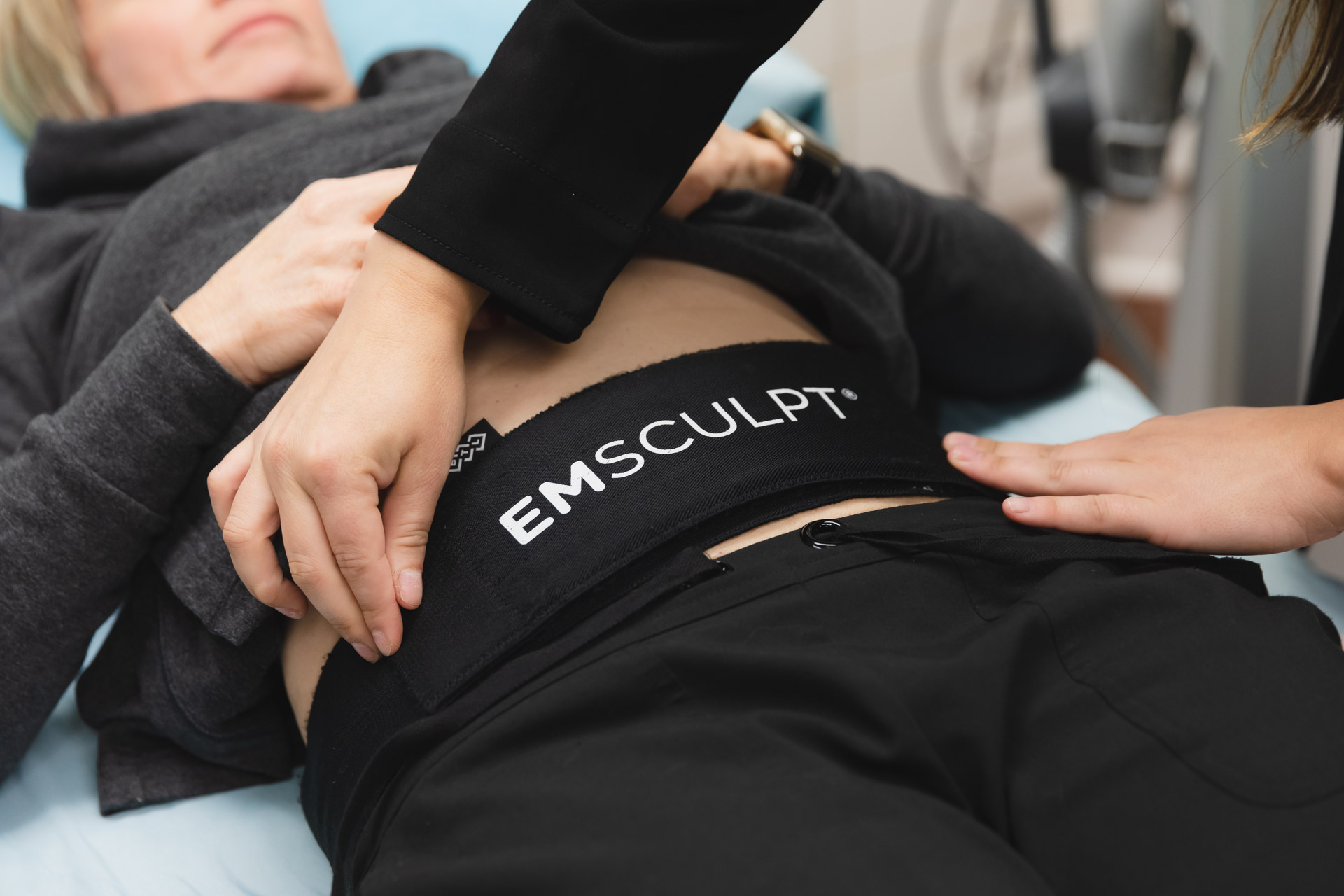 Emsculpt Neo device in use for non-invasive body sculpting, fat reduction, and muscle toning treatment.
