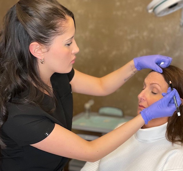 Facial mapping on a female client before dermal filler treatment at Catara Med Spa in Algonquin, IL.