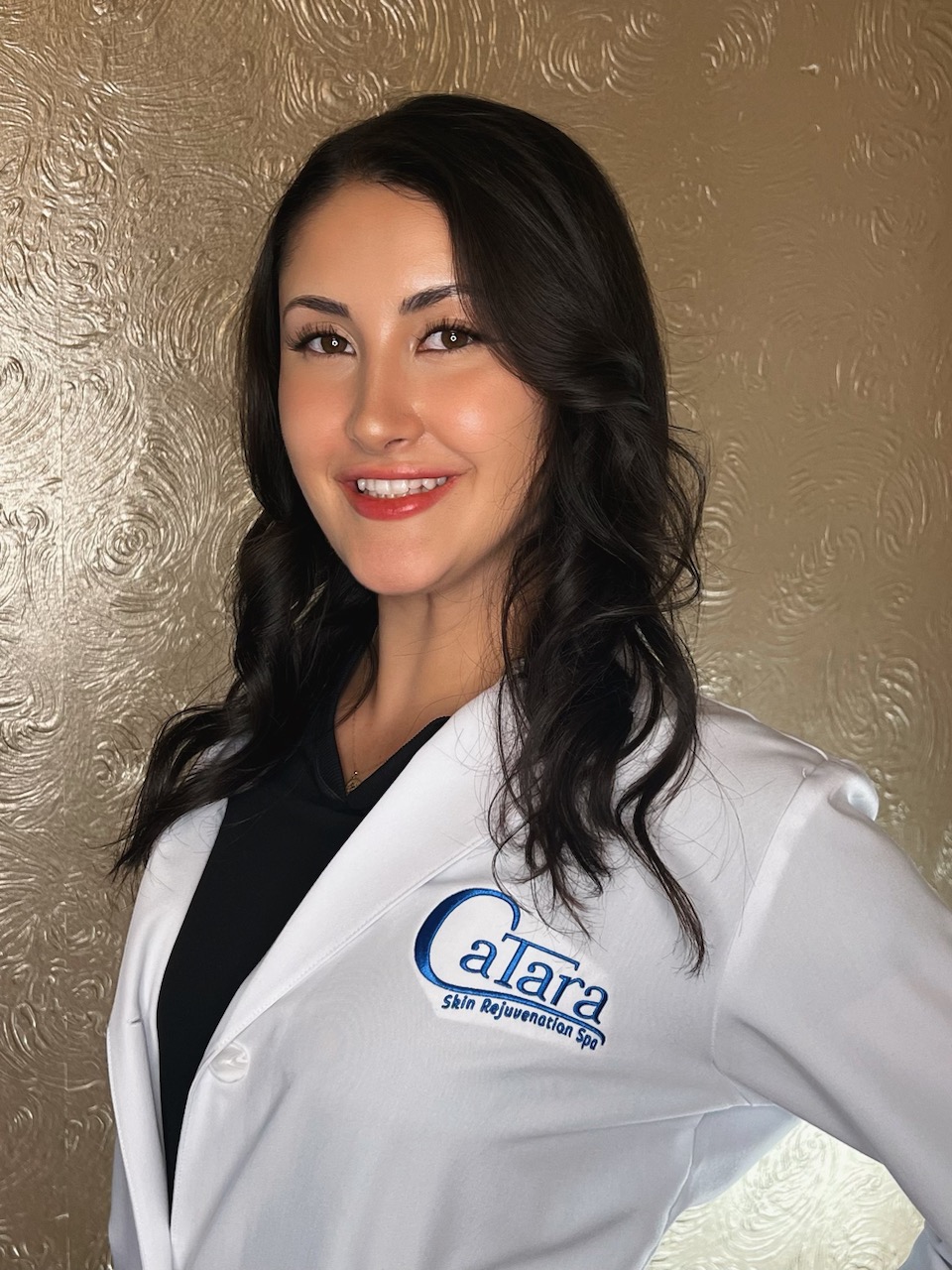 Lily Zelaya, registered nurse and aesthetic nurse injector at Catara Med Spa in Algonquin, IL, in a white lab coat