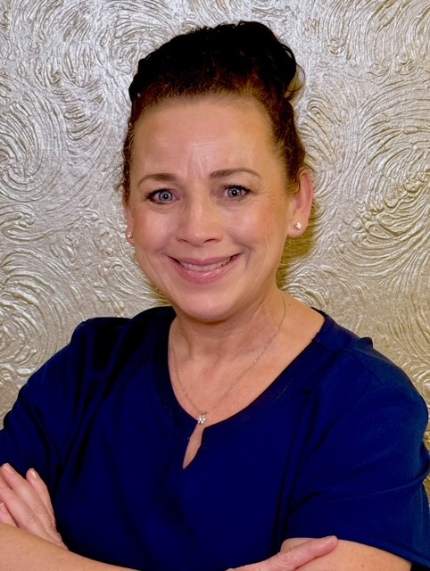 Lynette Reedy, certified medical assistant at Catara Med Spa in Algonquin, IL, in front of a textured gold wall