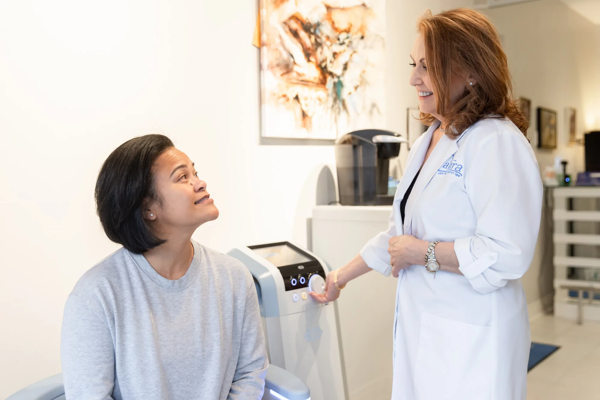 Patient consulting with specialist about Emsella pelvic floor therapy at Catara Med Spa in Algonquin, IL.