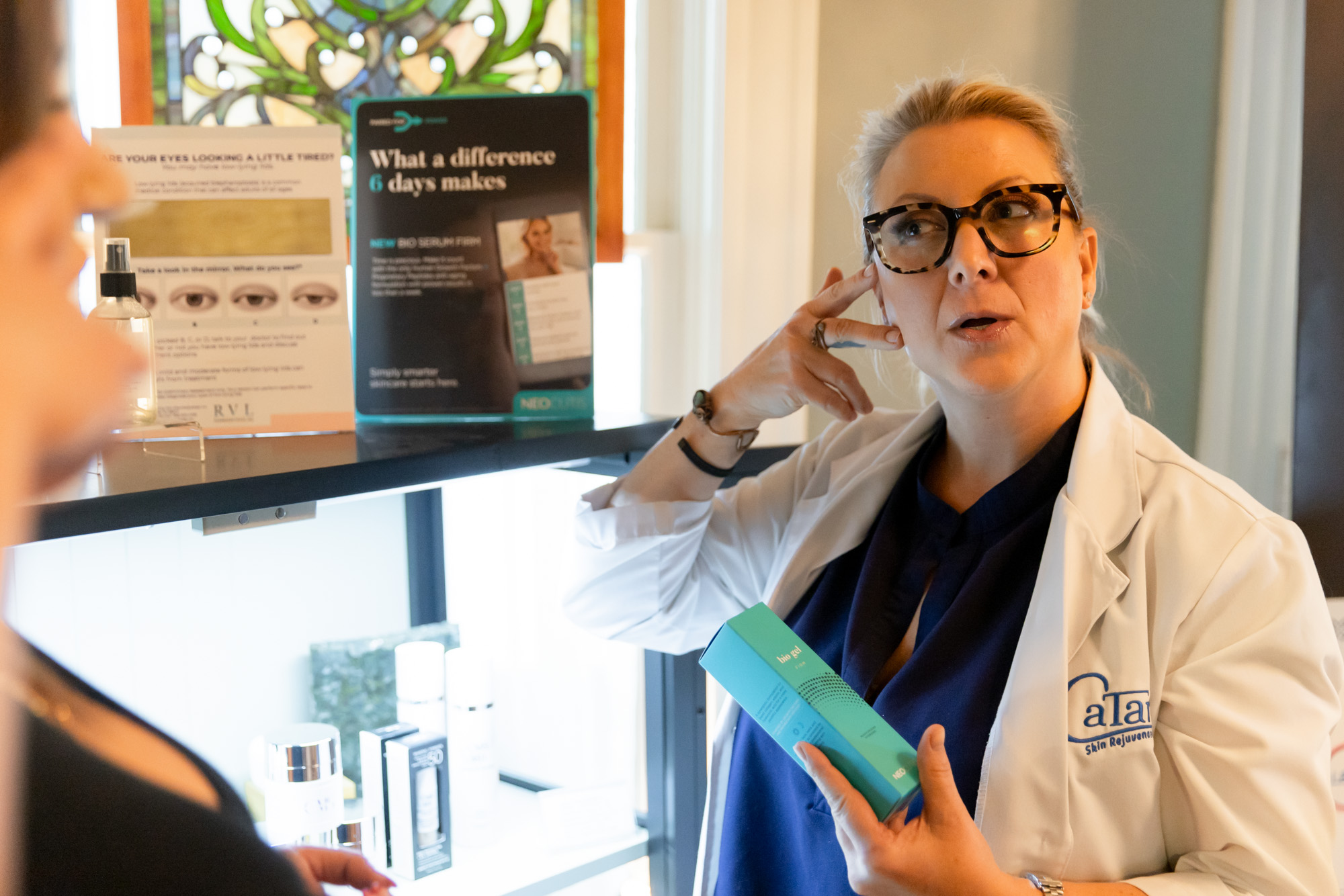 Catara Med Spa provider reviewing medical-grade skincare products with a client in Algonquin, Illinois